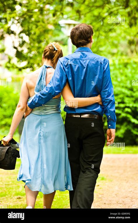 Young Couple Embraced And Walking Away Stock Photo Alamy