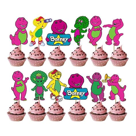 Cupcakes With Pink Frosting And Various Cartoon Characters On Them Are