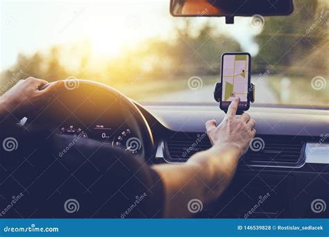 Driver Using Gps Navigation In Mobile Phone While Driving Car Stock