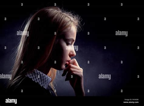Sad Pensive Girl On Black Background Stock Photo Alamy