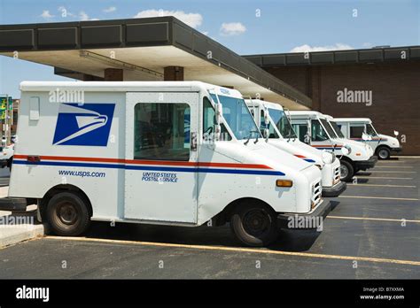 Illinois Dekalb United States Postal Service Mail Trucks Parked At Post Office Building Stock