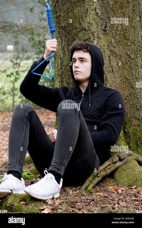 Depressed Teenage Boy With A Hangmans Noose Stock Photo Alamy