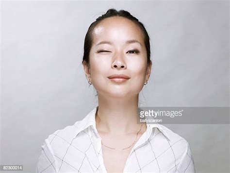 Chinese Woman Wink Photos And Premium High Res Pictures Getty Images
