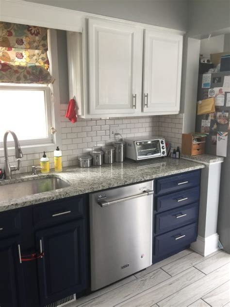 Think white cabinets above the sink paired with shades of blue, black, or brown below. What Color Should I Paint My Kitchen Cabinets? | Textbook ...