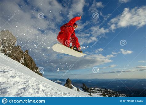 Snowboarder In A Jump Against The Blue Sky Stock Photo Image Of Cold