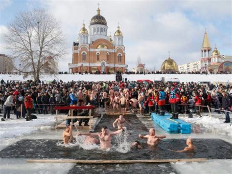 Russians Celebrate Epiphany By Diving Into Freezing Waters