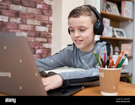 Boy Using Computer With Headphones Hi Res Stock Photography And Images