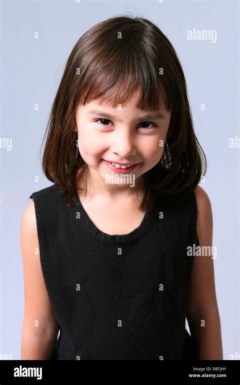 Pretty Little Caucasian Brunette Girl With Dimples Smiling Stock Photo