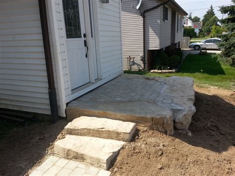 Armour Stone Retaining Wall And Steps With Pre Cast Patio Glencoe