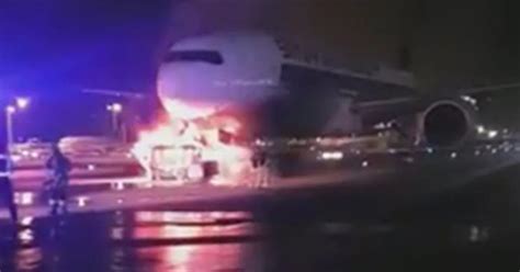Firefighters Battle To Save Plane As Truck Towing Passenger Jet Bursts