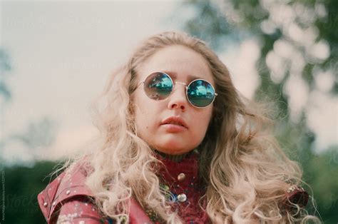a blond woman with vintage glasses by stocksy contributor anna malgina stocksy
