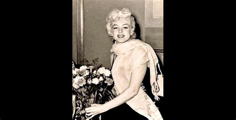 Early Marilyn Monroe Holding A Bouquet Of Flowers Marilyn Monroe Revealed