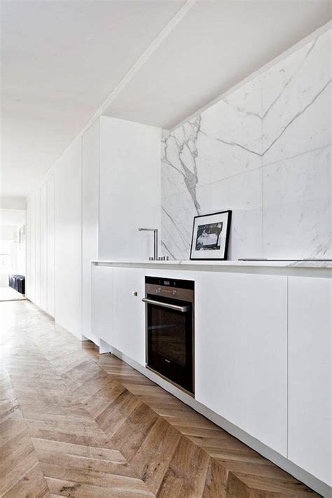 The tile's white marble with gray veining and smooth honed finish are the perfect combination, while the herringbone pattern creates a classic look. 25 Marble Kitchen Backsplashes For A Refined Touch - DigsDigs