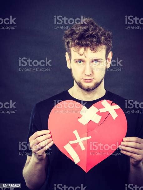 Sad Man With Glued Heart By Plaster Stock Photo Download Image Now