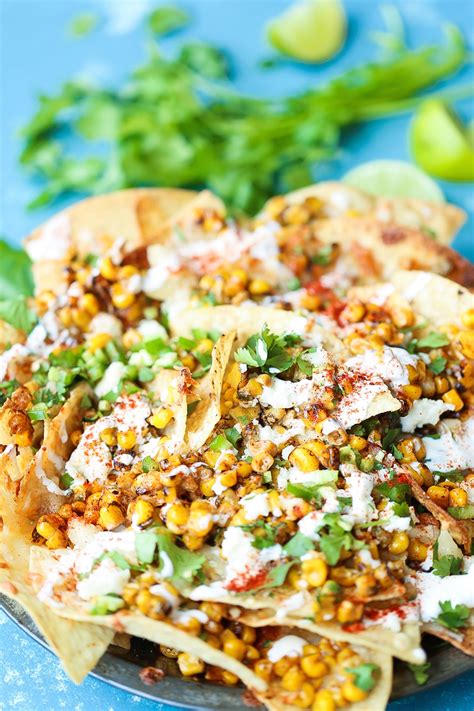 Without a grill, katie improvised and roasted the corn in the oven to achieve similar results, then slathered the cob with creamy, spicy mayo and topped it with cotija cheese and cilantro. Mexican Street Corn Nachos - Damn Delicious