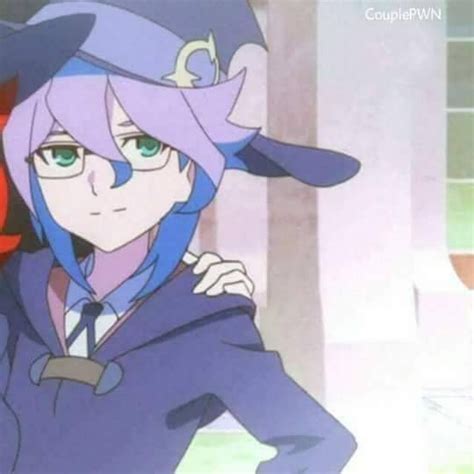 An Anime Character With Purple Hair And Green Eyes Wearing A Blue Suit