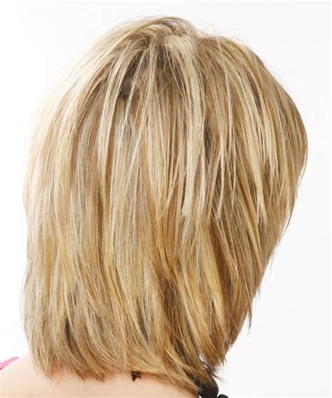 Straight Mid Length Blonde Feathered Hairstyle With Layered Bangs