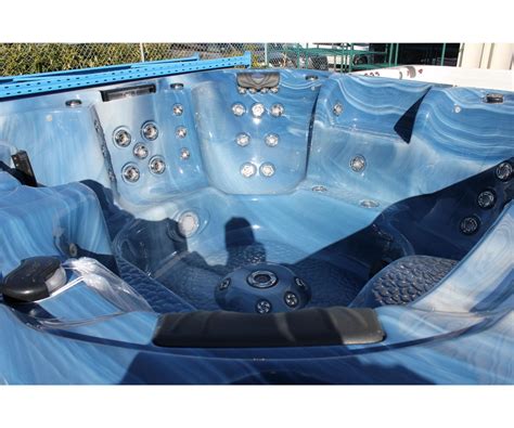 Cal Spas Escape Select Series Hot Tub With Sky Blue Interior And 8 Grey Cabinet C W Able