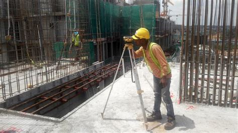 Completing fast, secure and easy surveys. Surveyor With Survey Equipment At The Construction Site ...