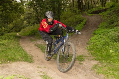 Man Riding A Mountain Bike Downhill Style Editorial Photography Image Of Bike Forest