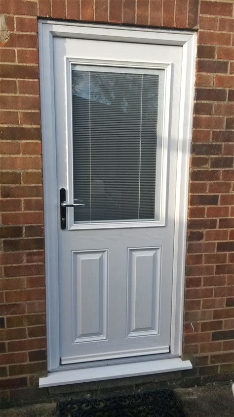Upvc Rear Entrance Door With Integrated Blind Supplied And Installed By