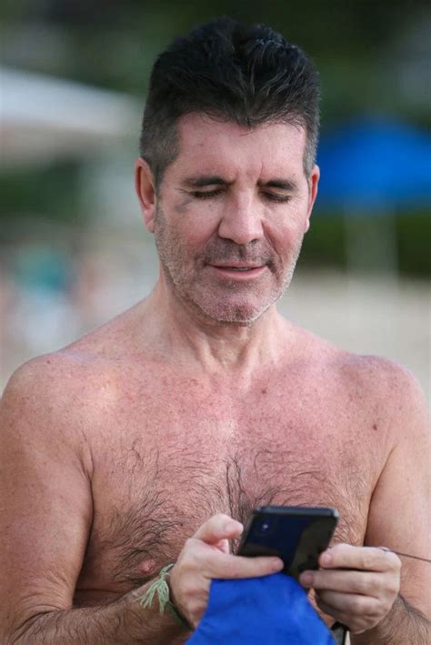 simon cowell spotted with black eye and fit physique while on vacation eye black simon cowell