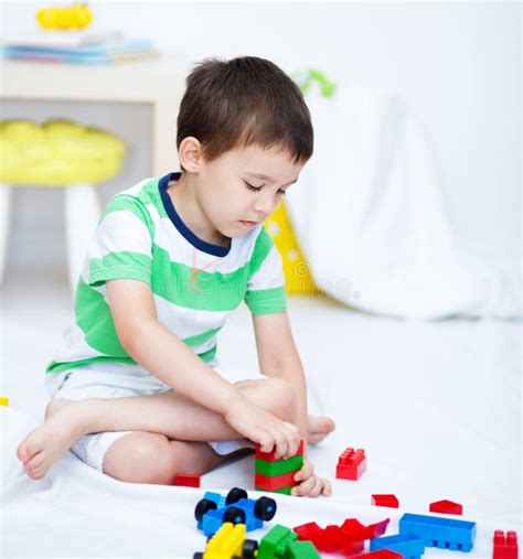 Boy Is Playing With Building Blocks Stock Photo Image Of Construction