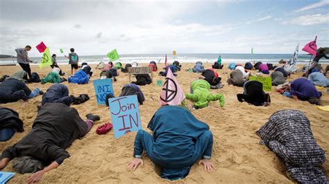 Extinction Rebellion Head In The Sand Protest At Manly Beach The