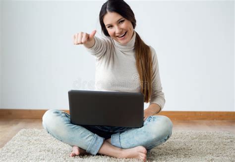 Beautiful Young Woman Working On Her Laptop At Home Stock Image