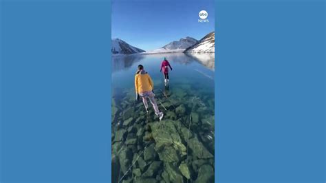 Skaters Glide Over Ice Window Frozen Lake Good Morning America