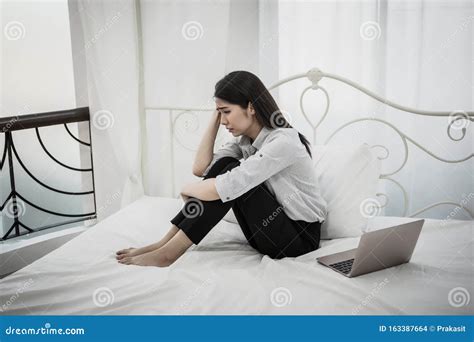 Depressed Woman Sitting Crying On Her Bed Stock Photo Image Of