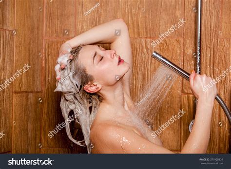 Beautiful Woman Standing Shower She Holds Stock Photo Shutterstock