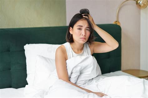 Portrait Of Sad Young Woman Waking Up Feeling Bad Wants To Sleep Wakes Early Morning Looking