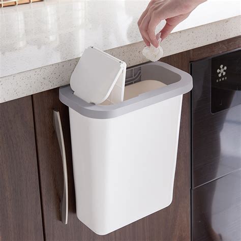 Even a trash can with lid can slide out from underneath the lid while containing smells when closed back in. Cabinet Door Hanging Trash Can with Lid Garbage Bin Waste ...