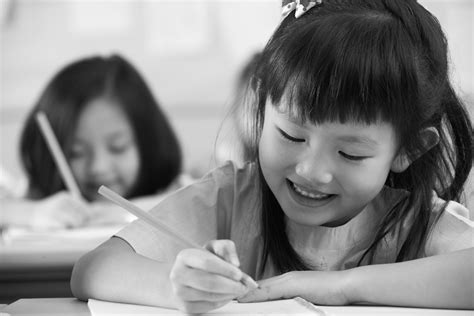 Chinese Children Working At Desks In Their Classroom Learnetic