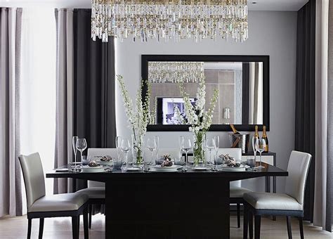 It includes a large display panel mounted on gray textured walls along with white pendants. 25 Elegant and Exquisite Gray Dining Room Ideas