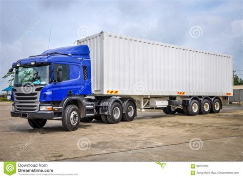 How to move shipping containers. Photo Of Big Tractor, With Container Trailer, To Deliver ...