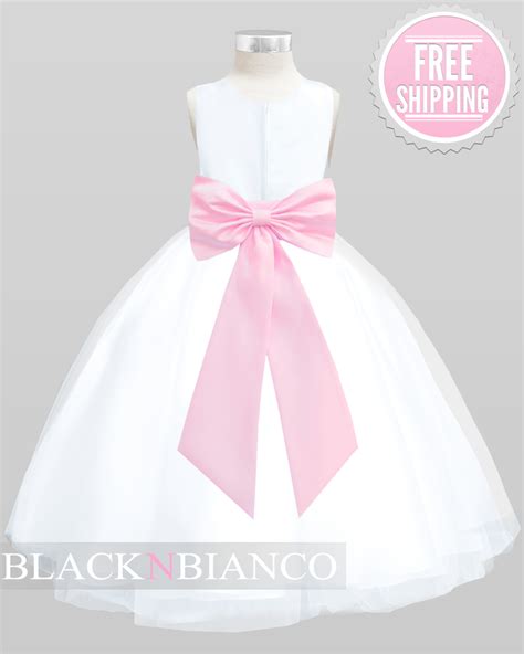 pink little princess dress with a sash flower and bow