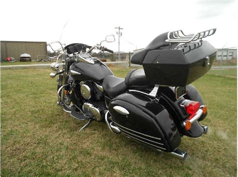 This kawasaki vulcan 1500 nomad has been upgraded with bag lid rails, front and rear fender rails, engine guard, running lights, cobra exhaust, and the backrest and windshield have been removed. 2004 Kawasaki Vulcan 1500 Nomad for sale on 2040-motos