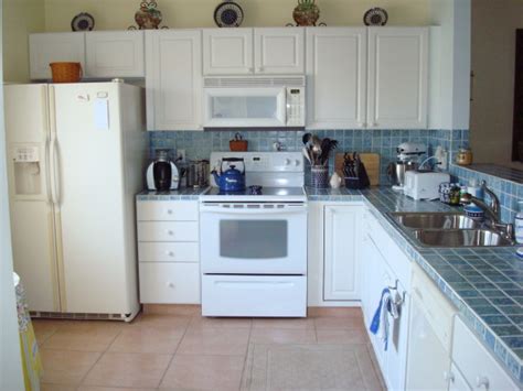 Please excuse the minimal photos. White Kitchen Cabinets and White Appliances - Decor ...
