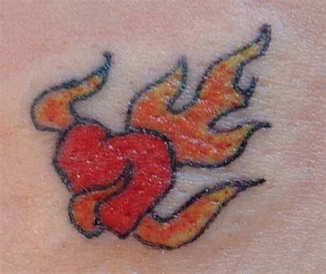 Heart On Fire Fire Heart Heart Tattoo Designs Heart Tattoo