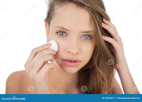 Attentive Brunette Model Rubbing Her Face With Cream Stock Image Image Of Isolated Calm