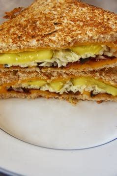 Sourdough, garlic spread, cheese wiz, swiss cheese, and dill pickles. Savory Sweet and Satisfying: Dill Pickle Bacon Grilled Cheese