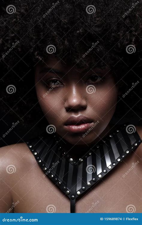 Beautiful African American Nacked Woman With Curly Hairstyle Wearing Leather Necklace With Metal