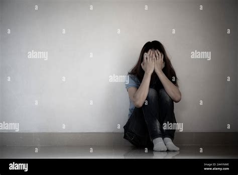 Sad Woman Hug Her Knee And Cry Sad Woman Sitting Alone In A Empty Room Stock Photo Alamy
