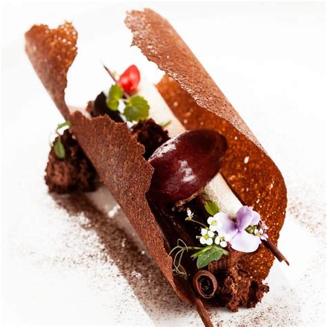 The course consists of sweet foods, such as confections, and possibly a beverage such as dessert wine and liqueur. "Black forest chocolate dessert by @francoisdaubinet # ...