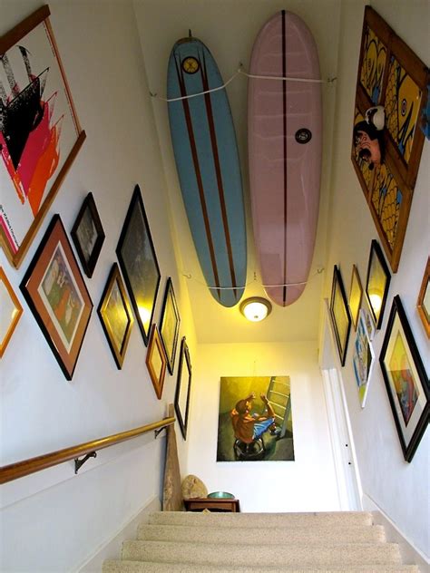 Just think of the number of prints that are currently rolled up for more ideas, consider the bookshelf, bathroom, even the floor as alternative ways to display art in your home. 16 Beachy Surfboard Decorating Ideas