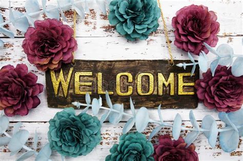 Welcome Sign With Flowers Frame Decorate On Pink Background Stock Image