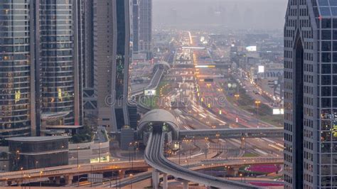 Busy Sheikh Zayed Road Aerial Day To Night Metro Railway And Modern