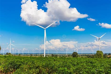 Wind Turbine Farm In Beautiful Nature With Blue Sky Blackground